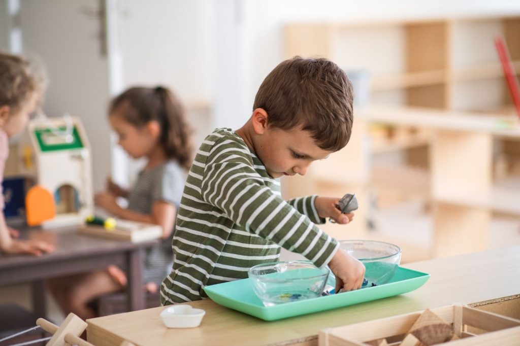 Child playing in nursery school.